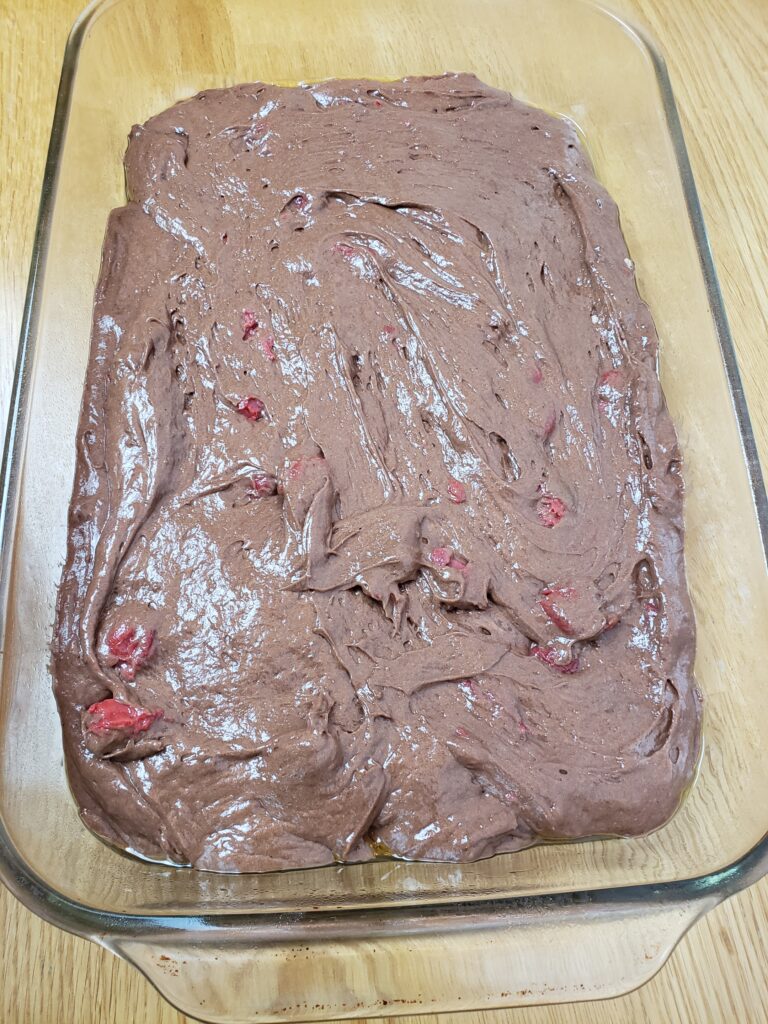 cake batter added to baking pan