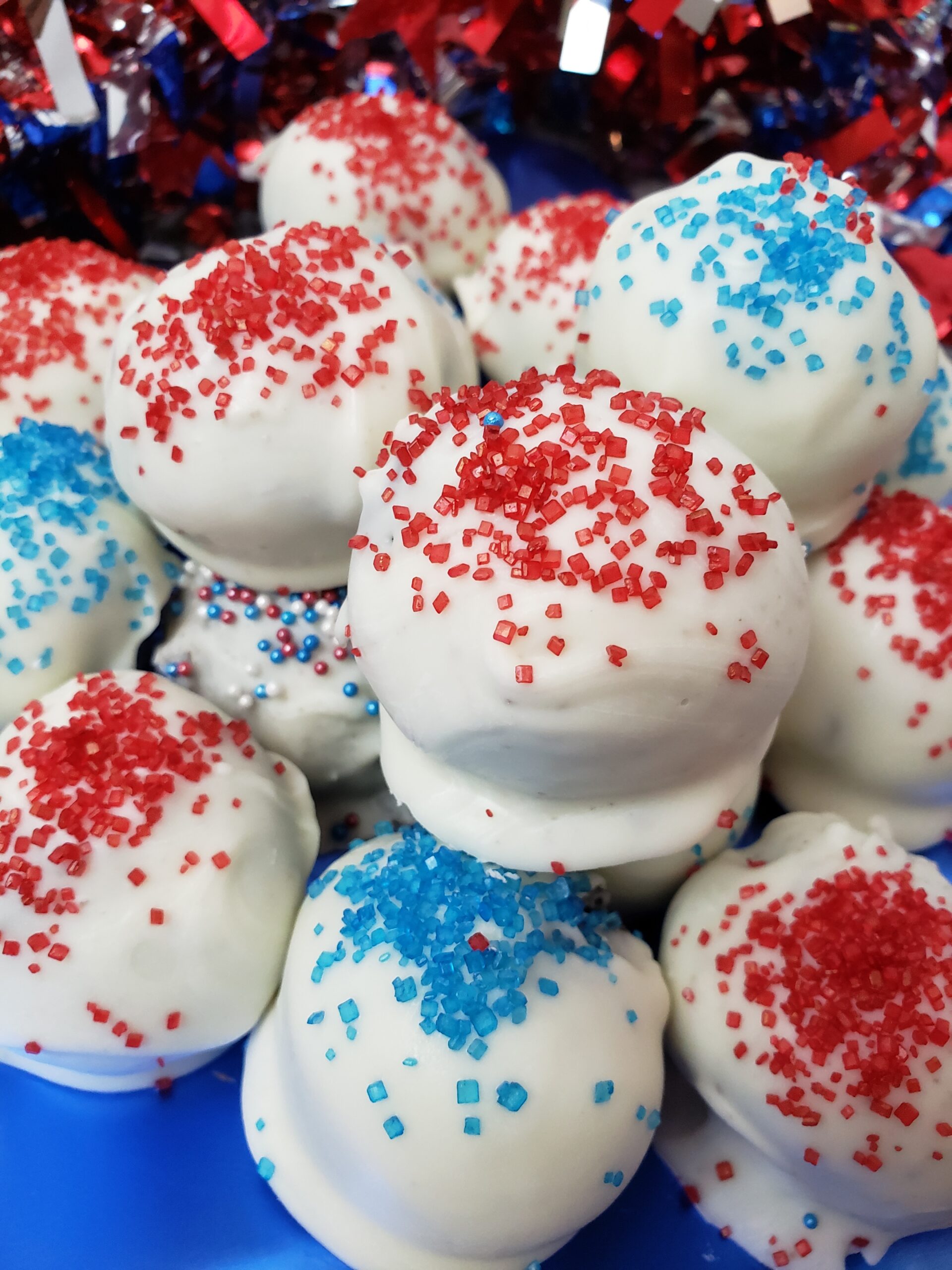 Patriotic truffles piled on a blue plate.