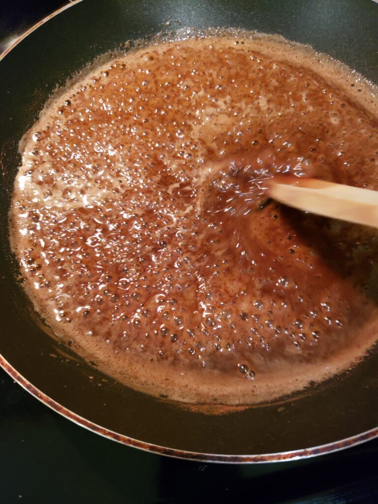 sugar and butter mixture simmering in skillet