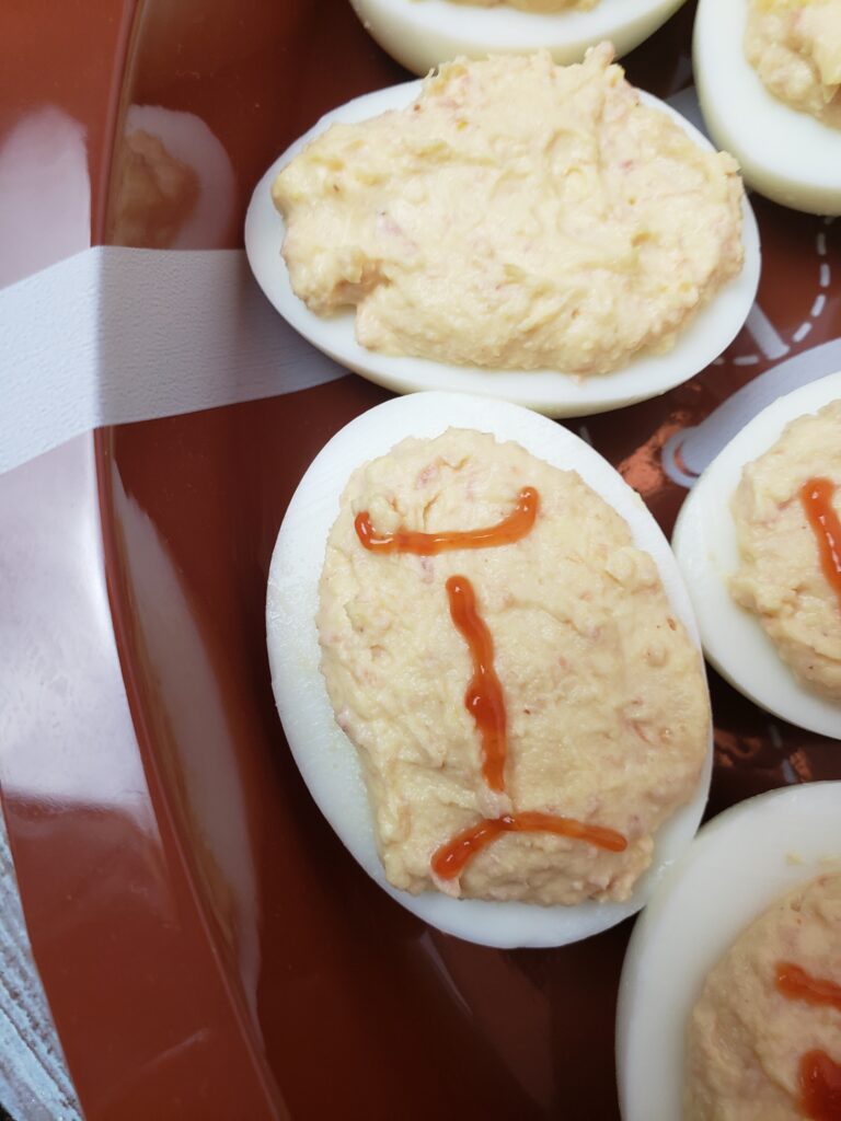 step 2 decorating a Game Day Football Deviled Egg