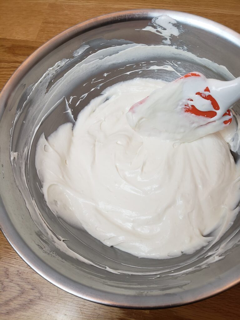 easy fruit dip mixed up in a mixing bowl.