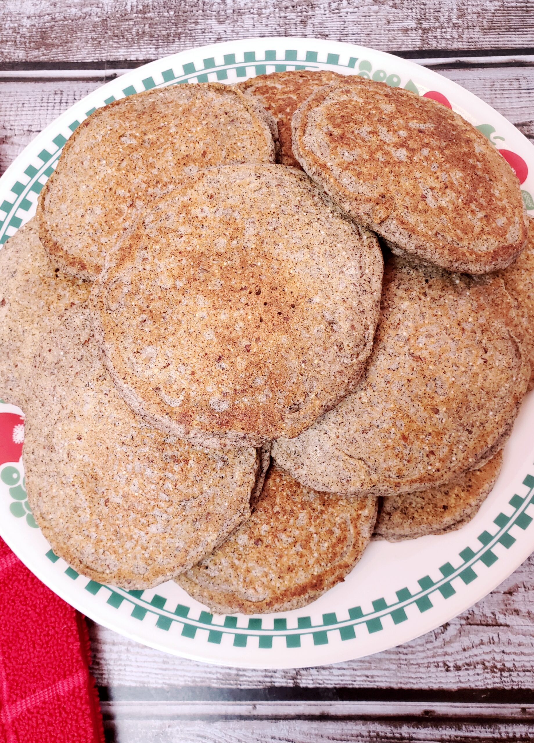 a pile of Buckwheat Almond Pancakes on a plate.