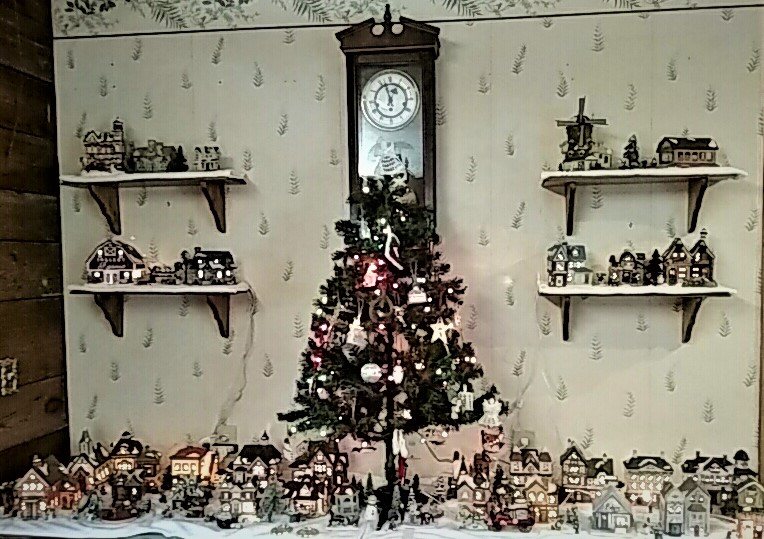 Christmas Village with tree in the center and clock over it