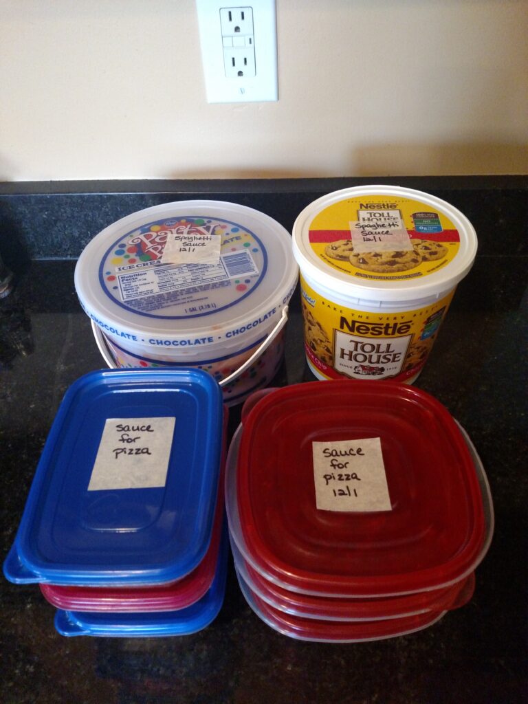 containers of pasta sauce ready for the freezer