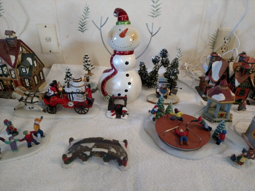 Christmas Village with large snowman in center