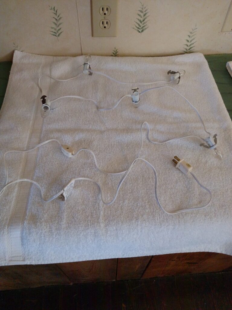 village cord laid out on white towel ready to wrap up