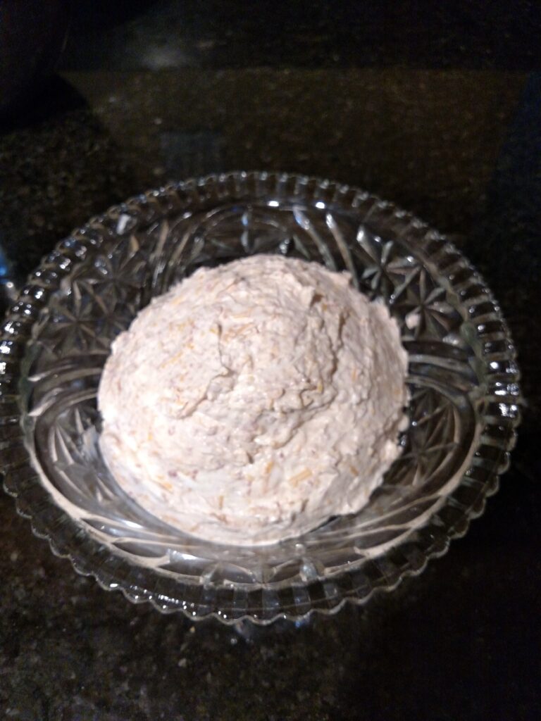 Cream Cheese Ball in a serving dish without the bacon bits yet