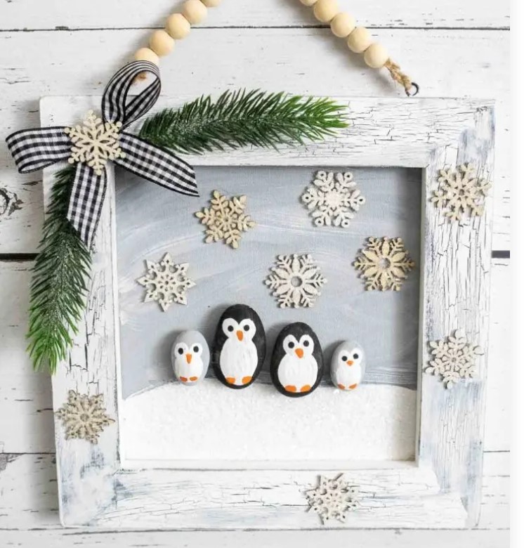 penguin family portrait with rocks