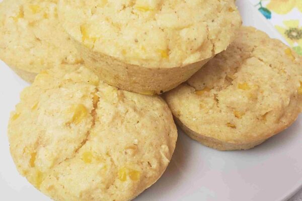 5 amazing cornmeal muffins served on a white plate