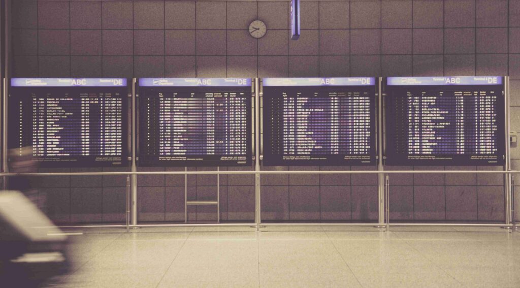 4 flight monitors at airport