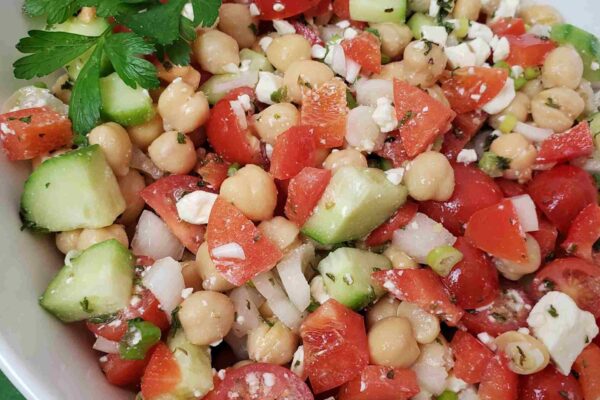Chickpea Salad chickpea salad in white bowl on green napkin