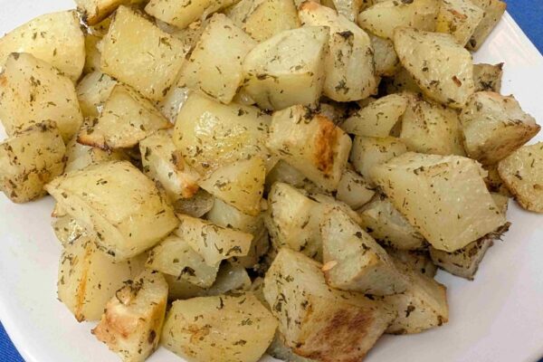 Oven Roasted Ranch Potato Bites oven roasted ranch potato bites on white plate on blue napkin
