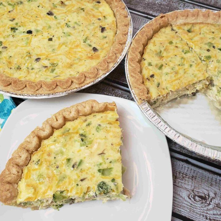 2 chicken broccoli quiches with one slice taken out onto a serving plate