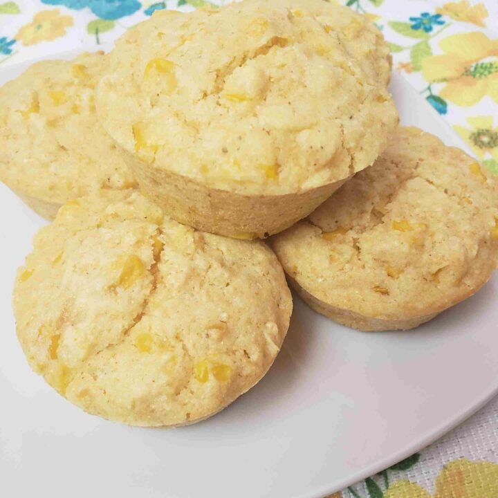 5 amazing cornmeal muffins served on a white plate