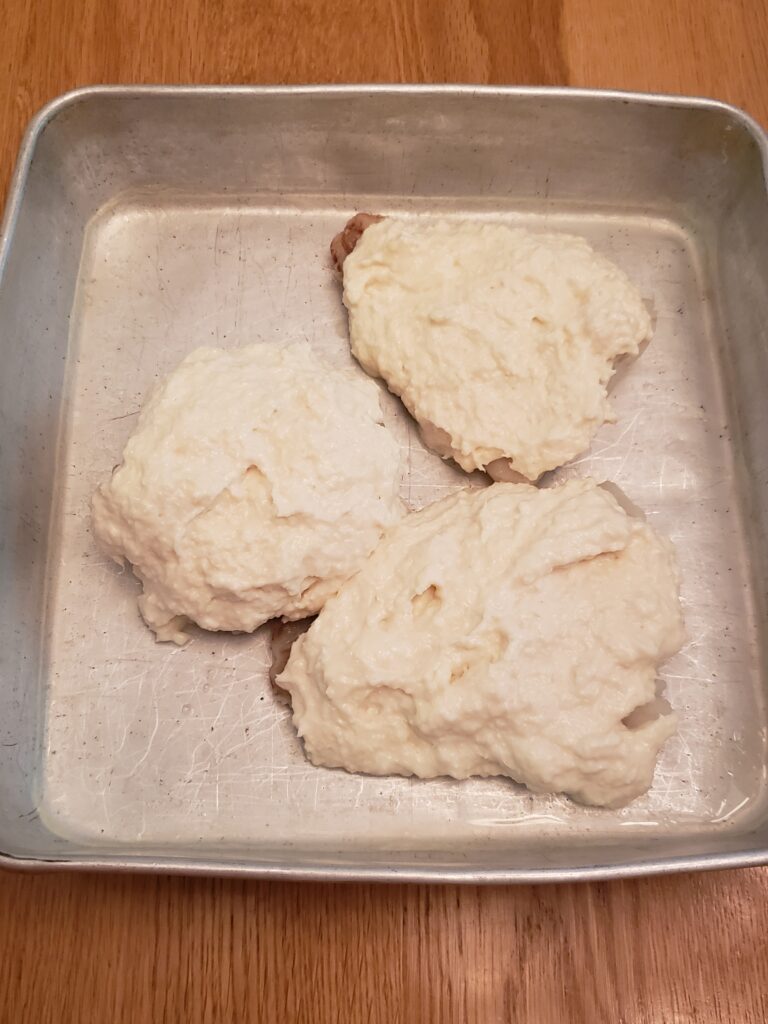 crab topped fish ready to bake