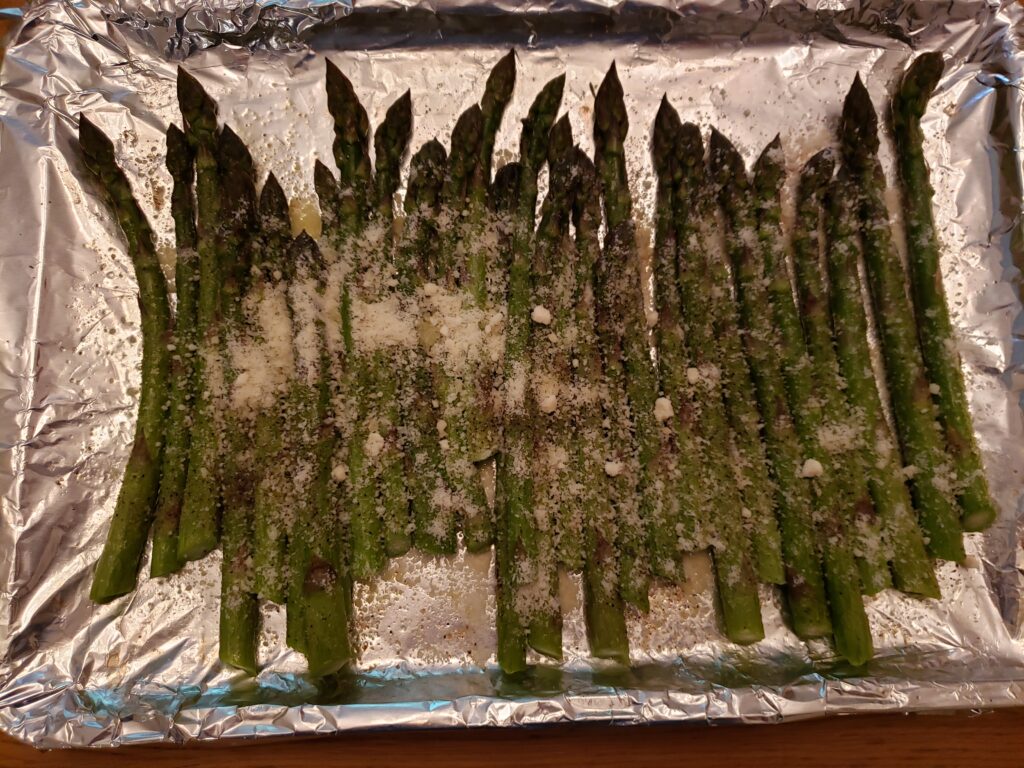 roasted parmesan asparagus on baking sheet