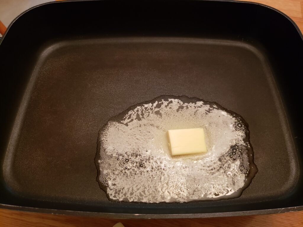 butter melting in skillet