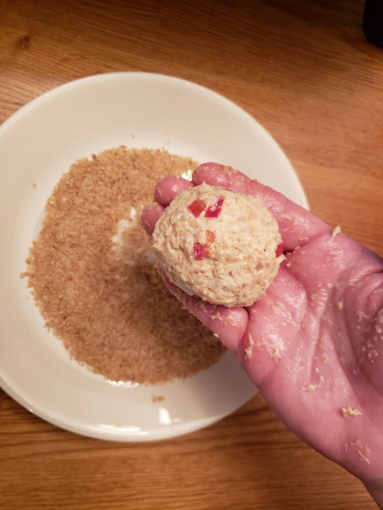 showing one gluten free salmon cake before cooking