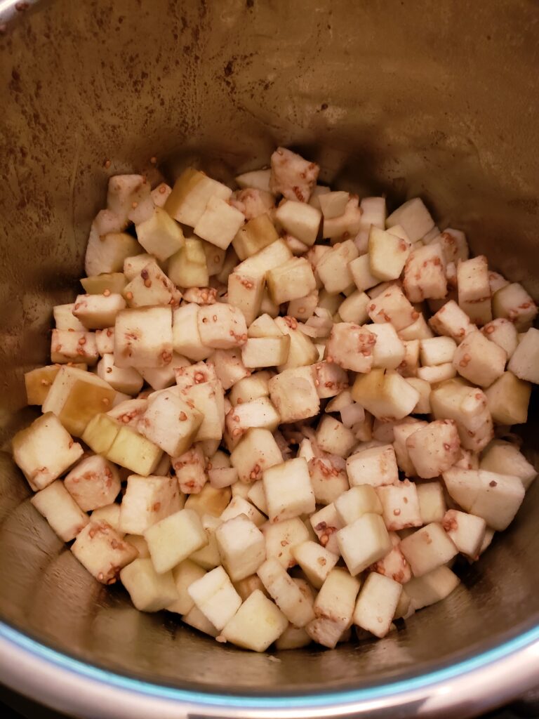 eggplant and other ingredients added to pot