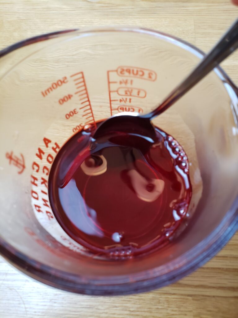 stirring red Jell-O