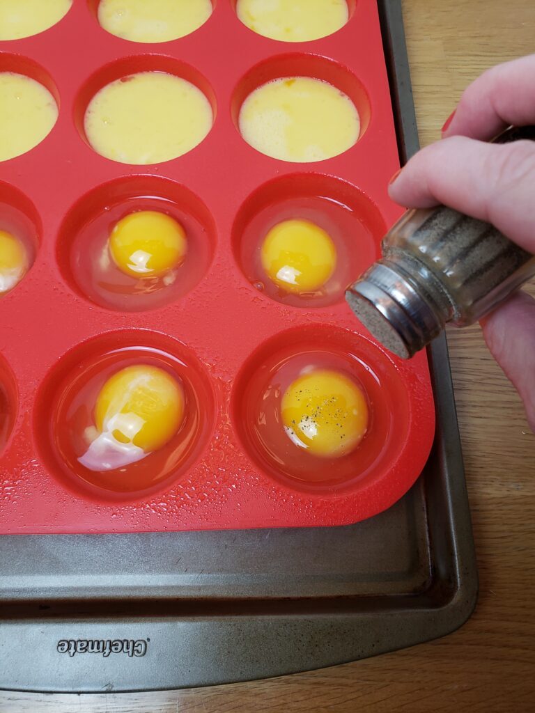 sprinkling pepper on eggs