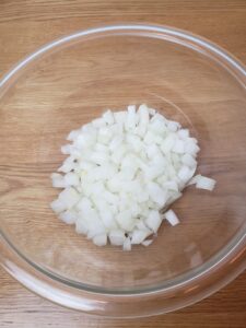 diced onions in a glass bowl