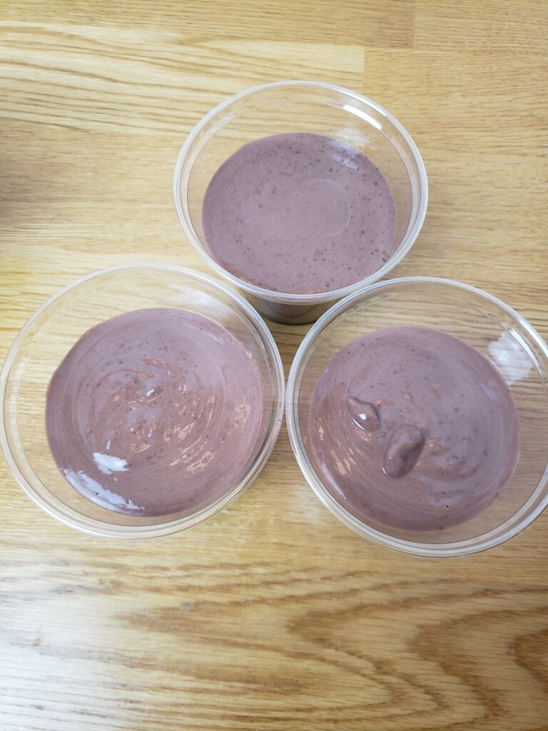 chocolate pudding in 3 plastic cups