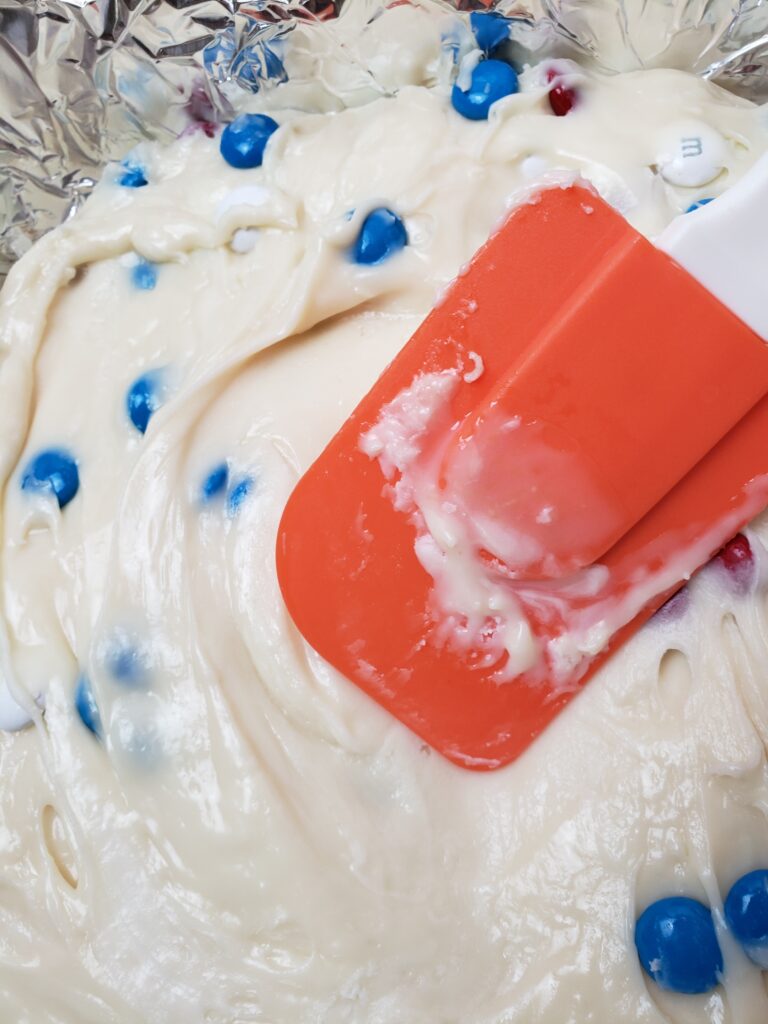 spreading the fudge in the pan