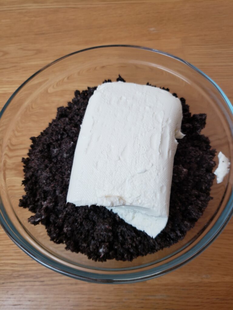 cream cheese and crushed oreos in a bowl