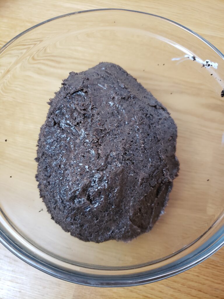 cream cheese and crushed oreos mixed together in a bowl