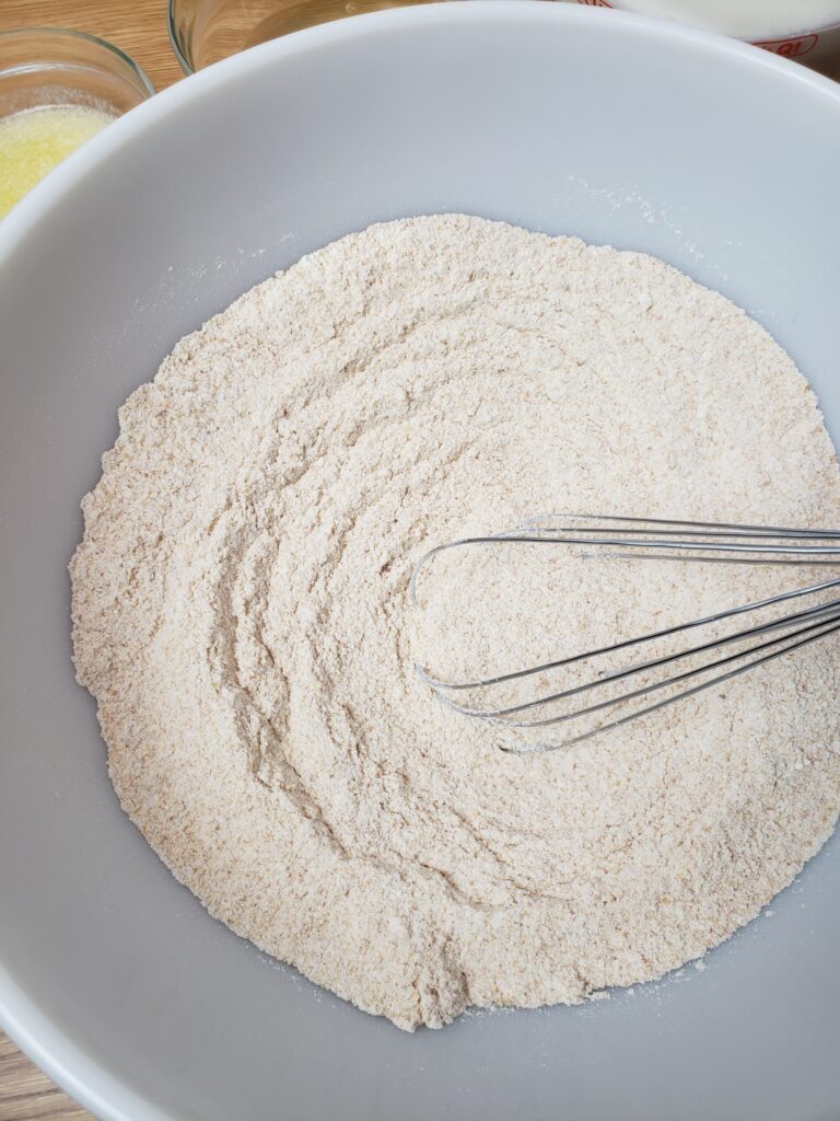 whisking dry ingredients in a bowl