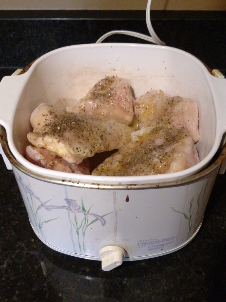 crock pot garlic herb chicken in crock pot before cooking