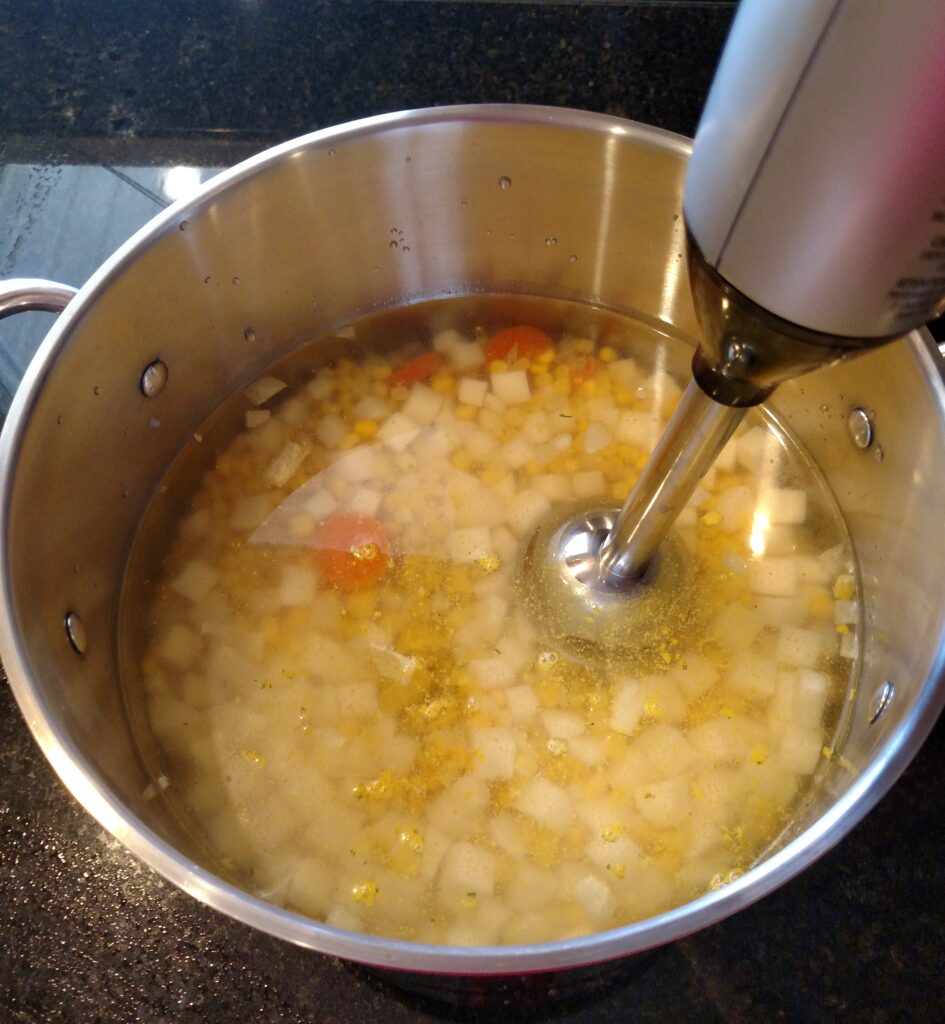blending soup with immersion blender to be smooth