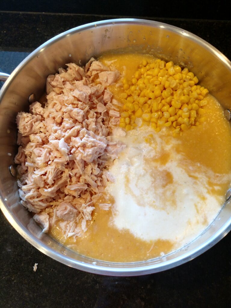 chicken, corn, potatoes and half and half added to pot