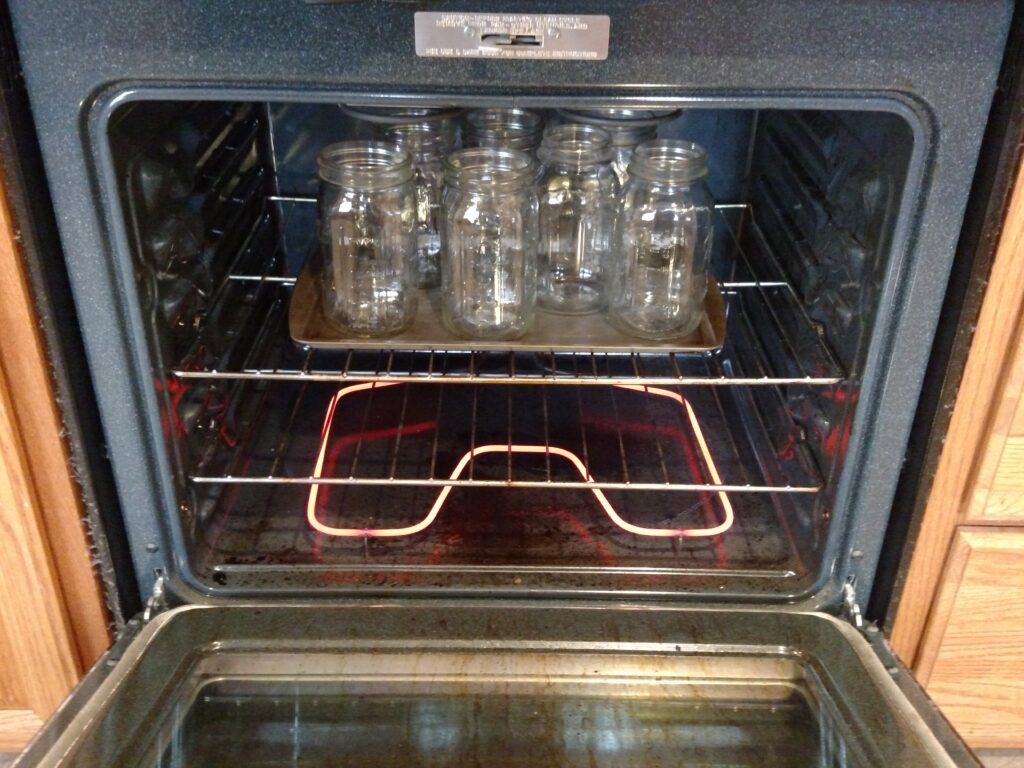 canning jars warming in oven