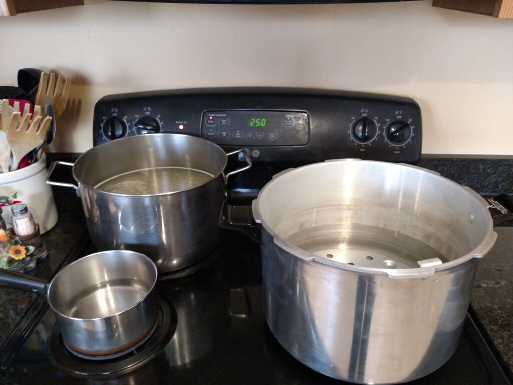 pots on stove ready to can
