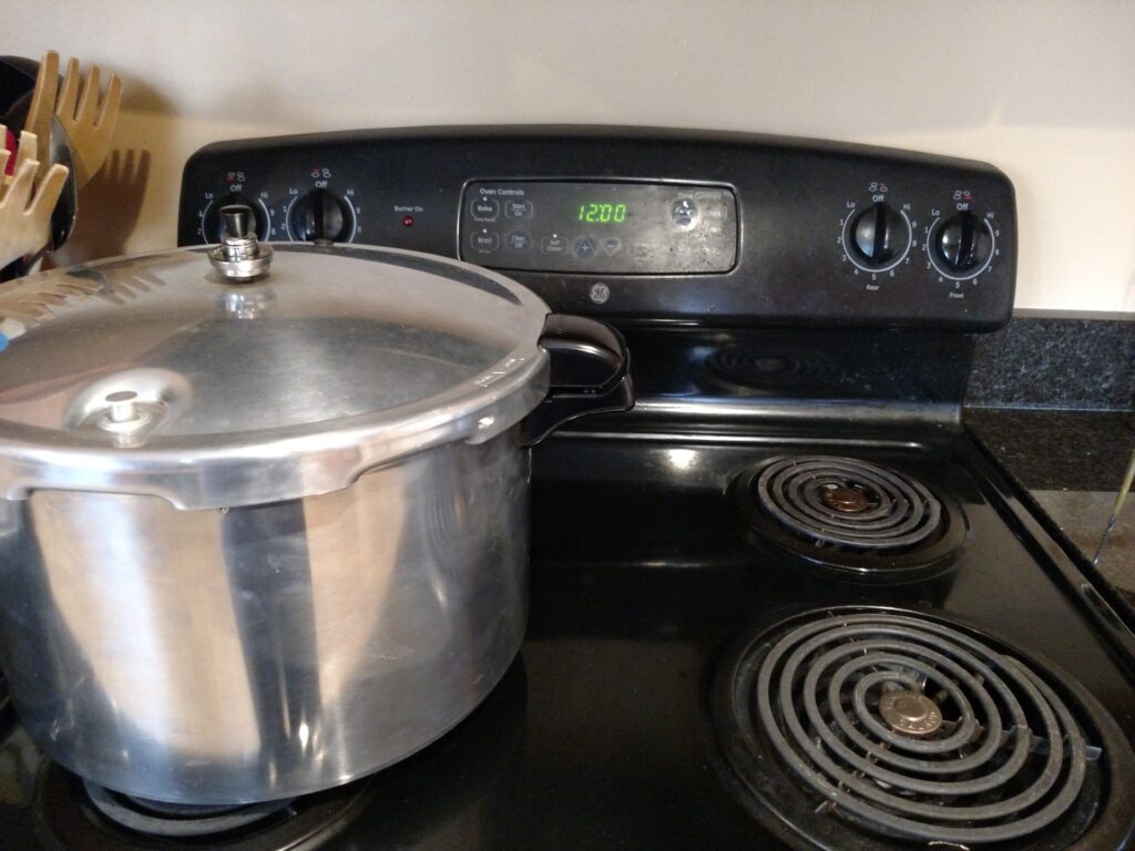 allowing the canner to cool and pressure to drop