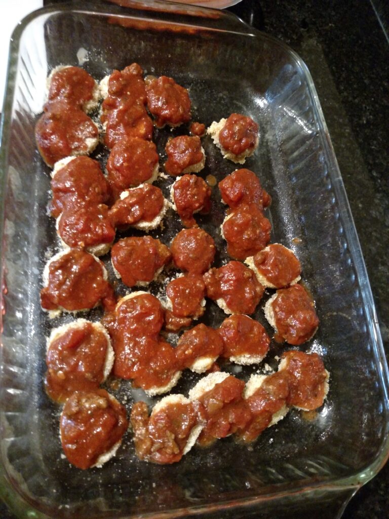 eggplant in baking dish with sauce on top