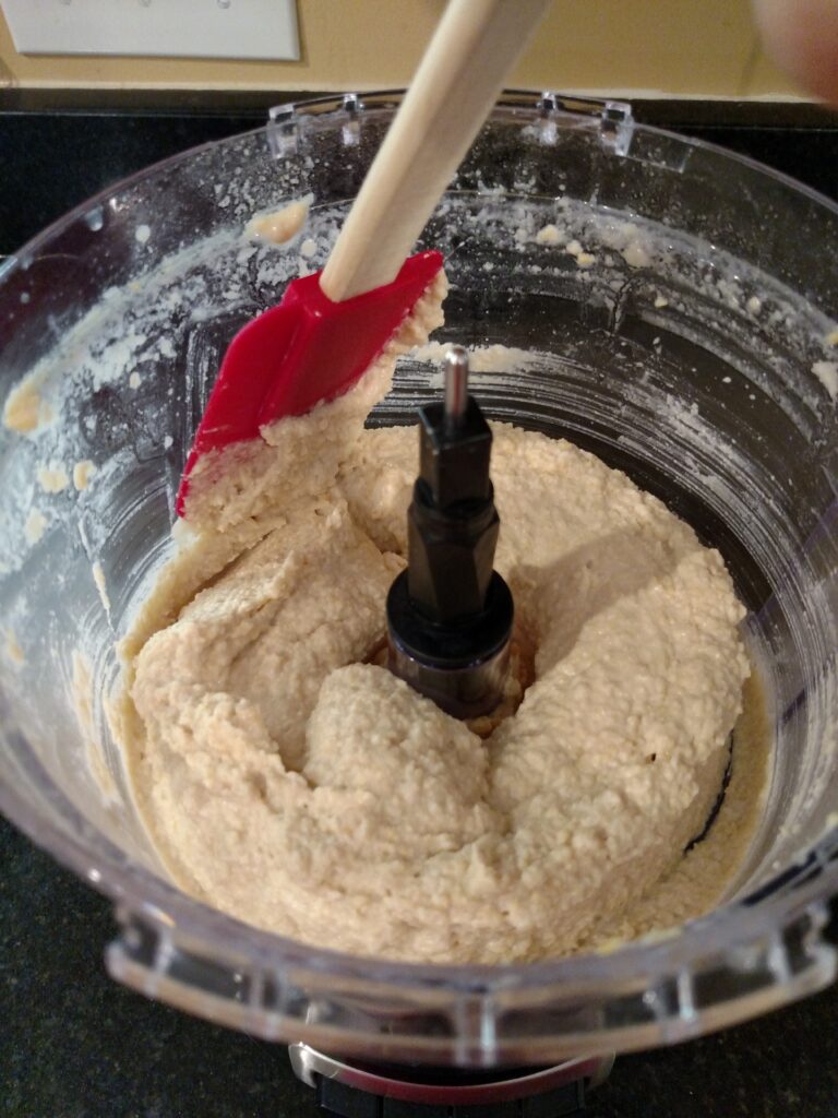 scraping down sides of food processor