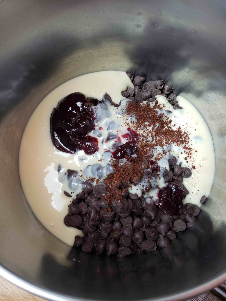 Ingredients for dark chocolate raspberry fudge in saucepan