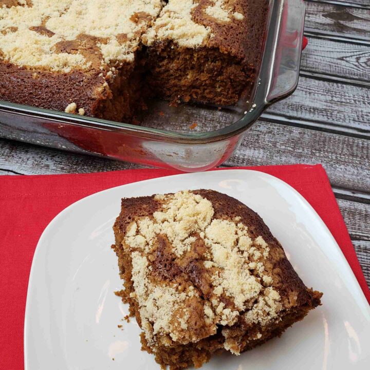 Shoo Fly Cake on serving plate next to baking pan