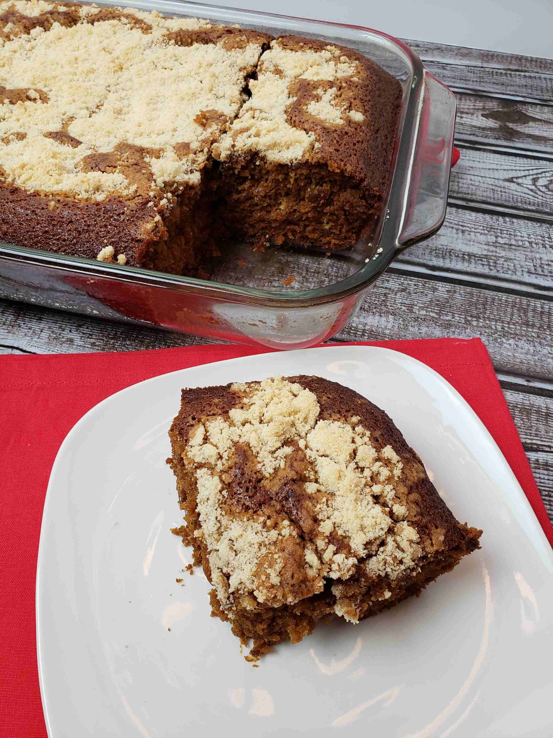 Shoo Fly Cake on serving plate next to baking pan