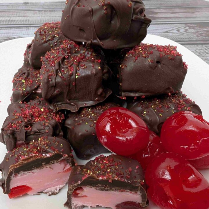 chocolate covered cherry fudge piled on white plate