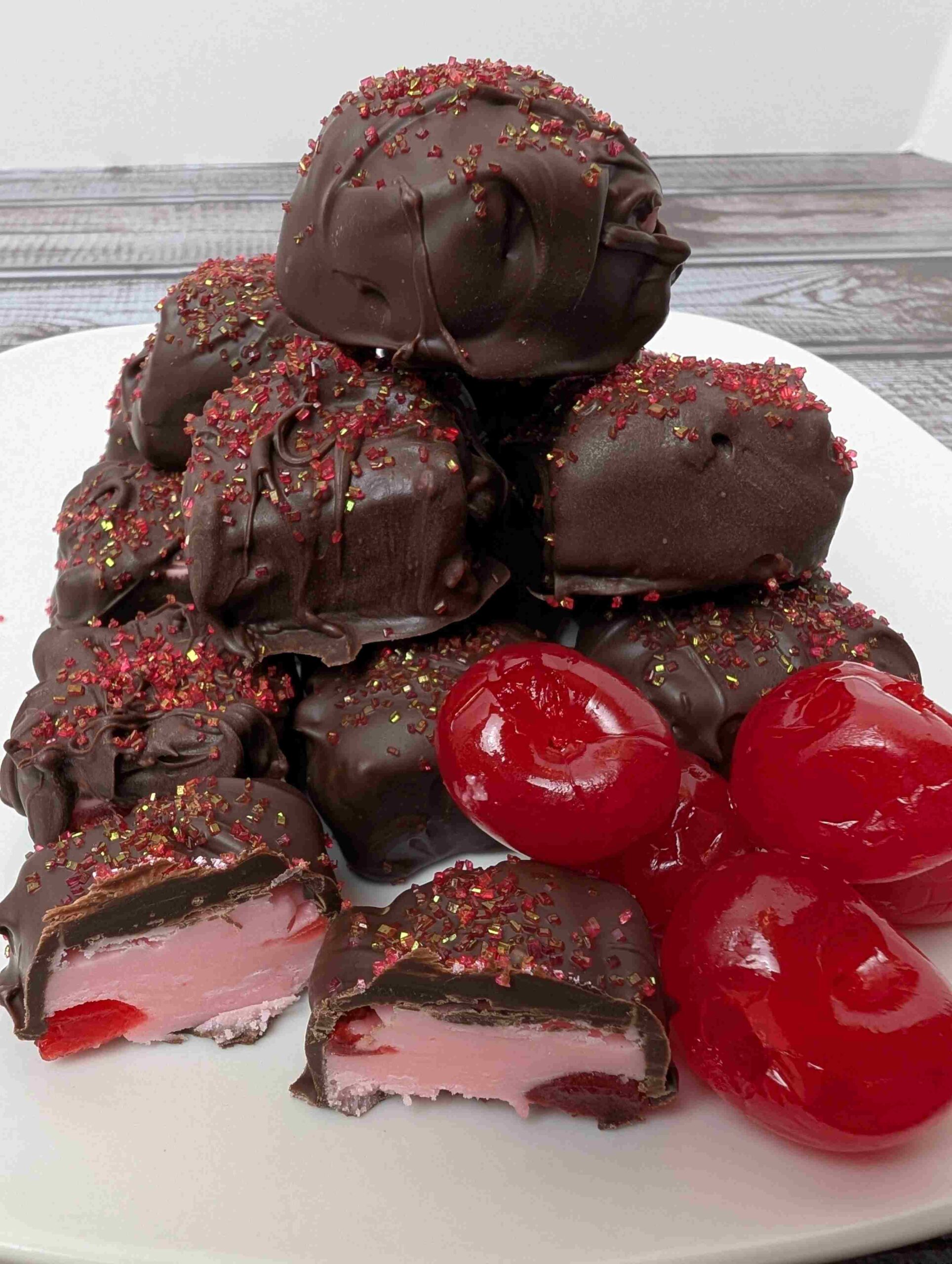 chocolate covered cherry fudge piled on white plate