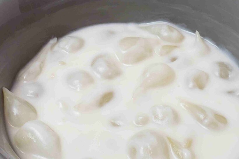 creamed onions in gray serving bowl