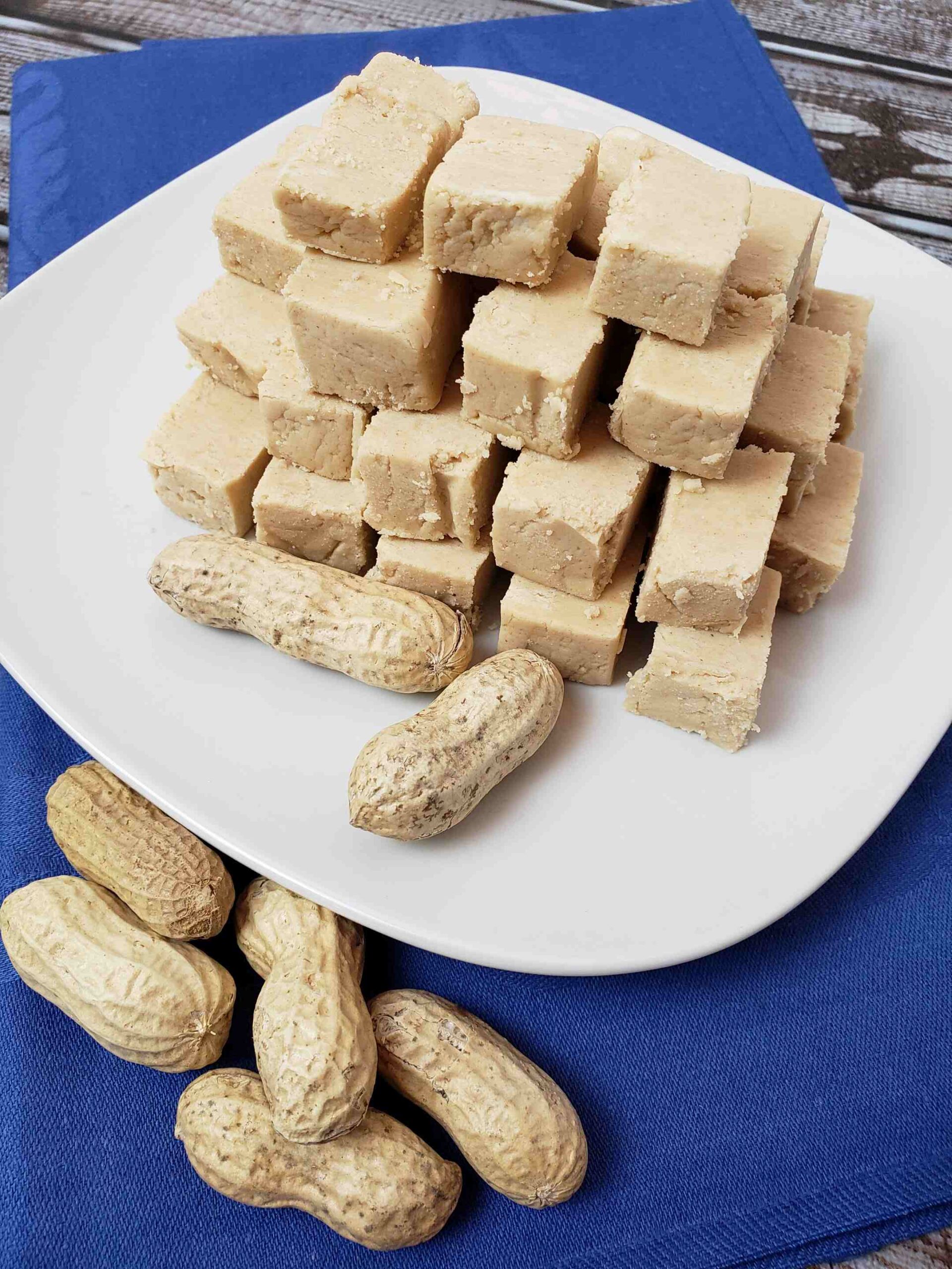 peanut butter and fluff fudge on white plate with blue napkin