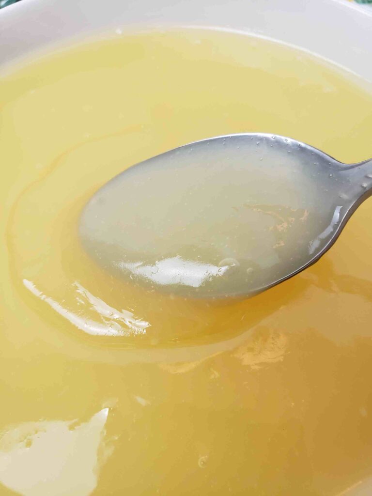showing thickness of vintage lemon butter on spoon