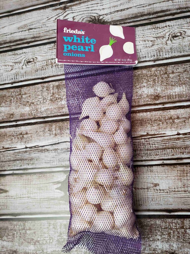 white pearl onions in grocery bag