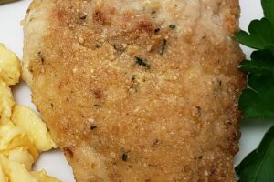 parmesan chicken on a white plate
