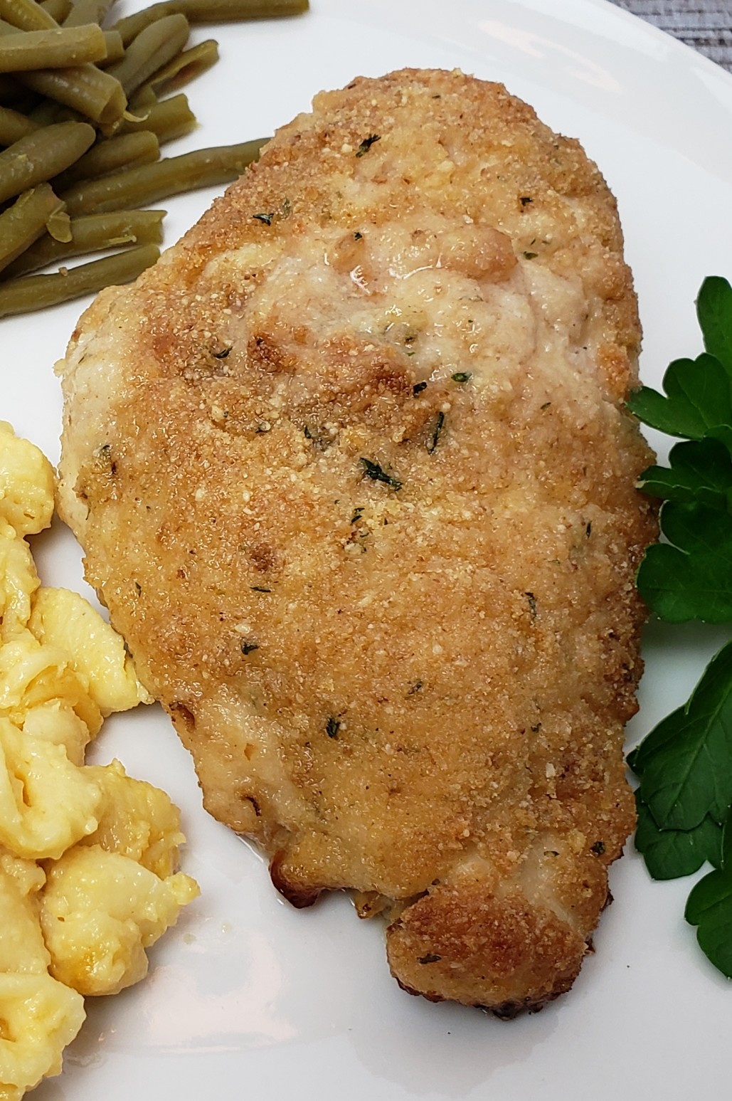 parmesan chicken on a white plate